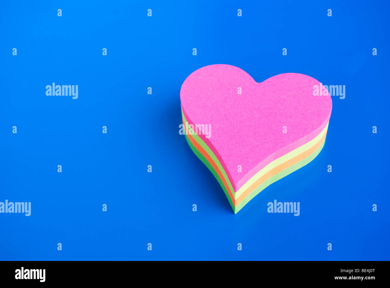 Notepad, heart-shaped, different coloured pieces of paper Stock Photo
