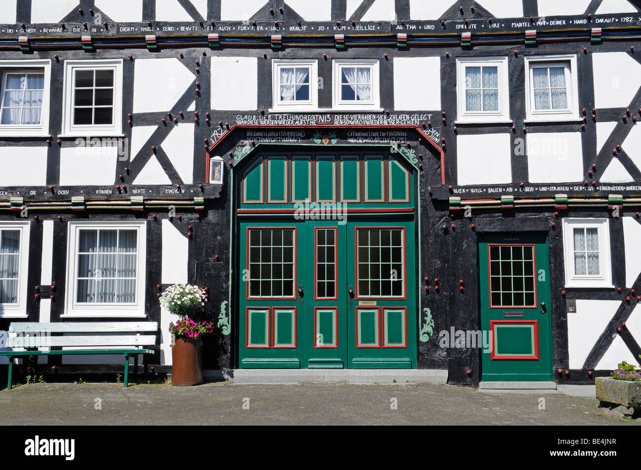 Ornate wooden door, entrance, half-timbered, house, Eversberg, Dorf, Meschede, Sauerland region, North Rhine-Westphalia, German Stock Photo