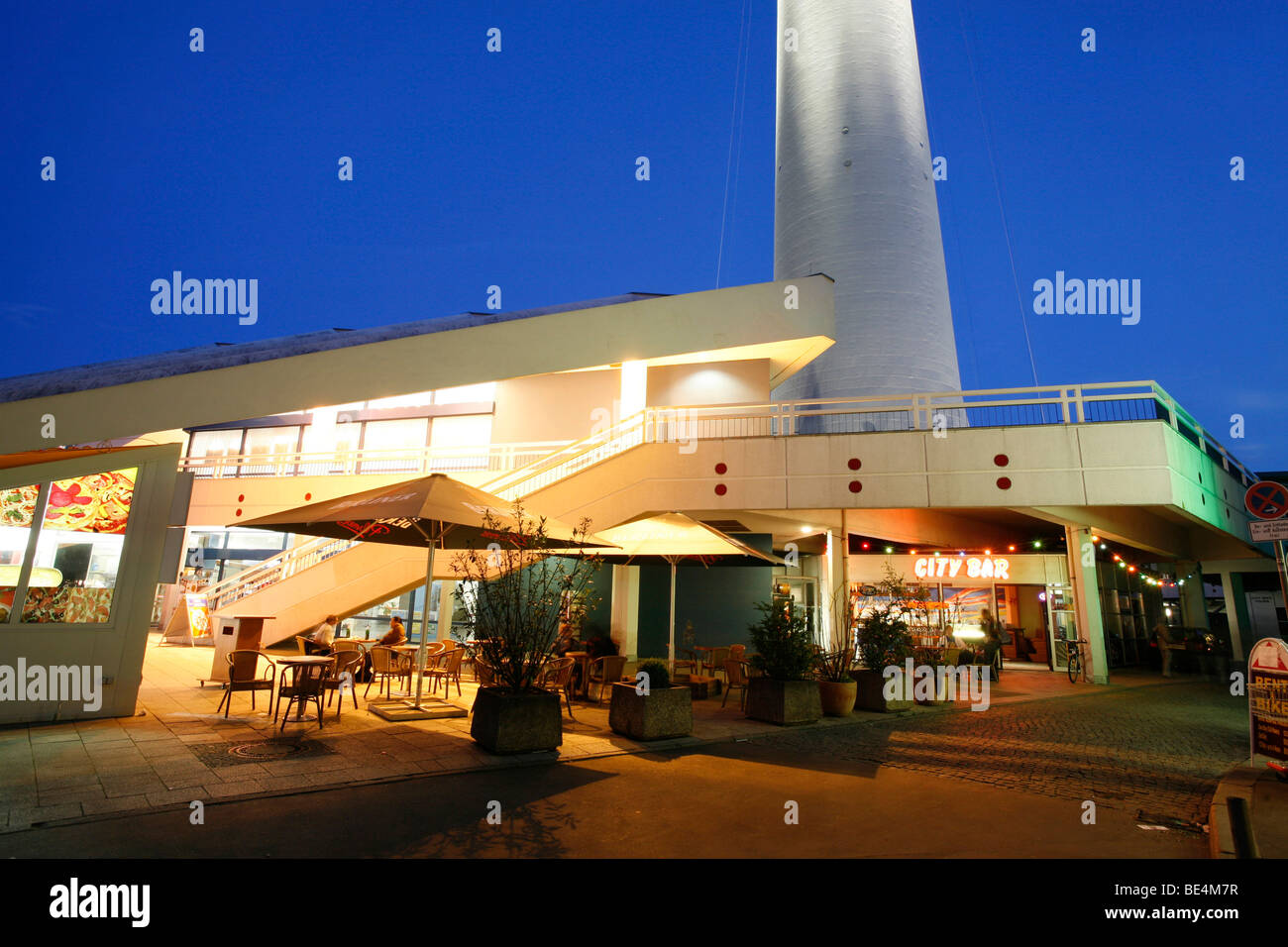 Forecourt of the Fernsehturm TV tower and Bahnhof Alexanderplatz station at the blue hour, Mitte district, Berlin, Germany, Eur Stock Photo