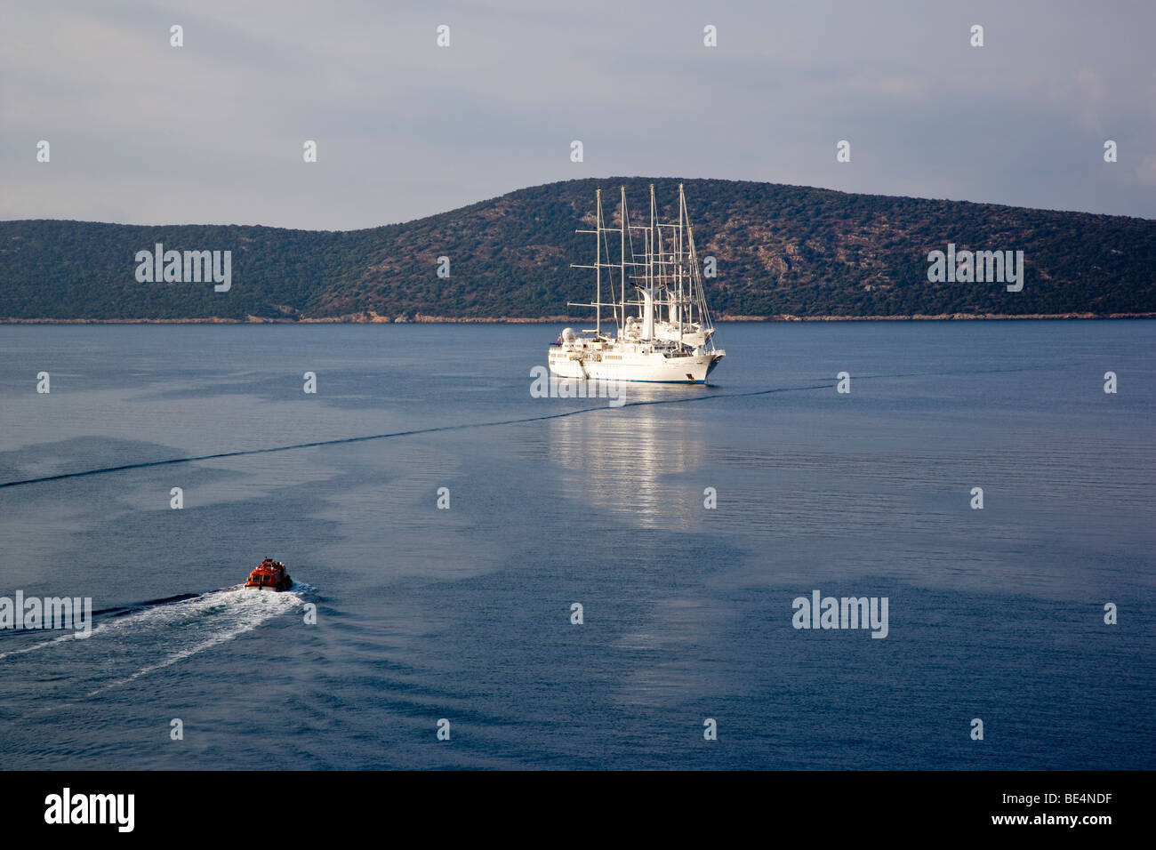 Tender going to cruise ship Wind Star on  a calm sea. Stock Photo