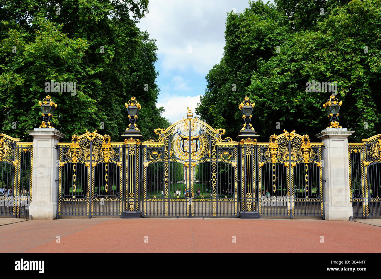 Wrought iron gates of the Buckingham Palace, in the back the St James Park, London, England, United Kingdom, Europe Stock Photo