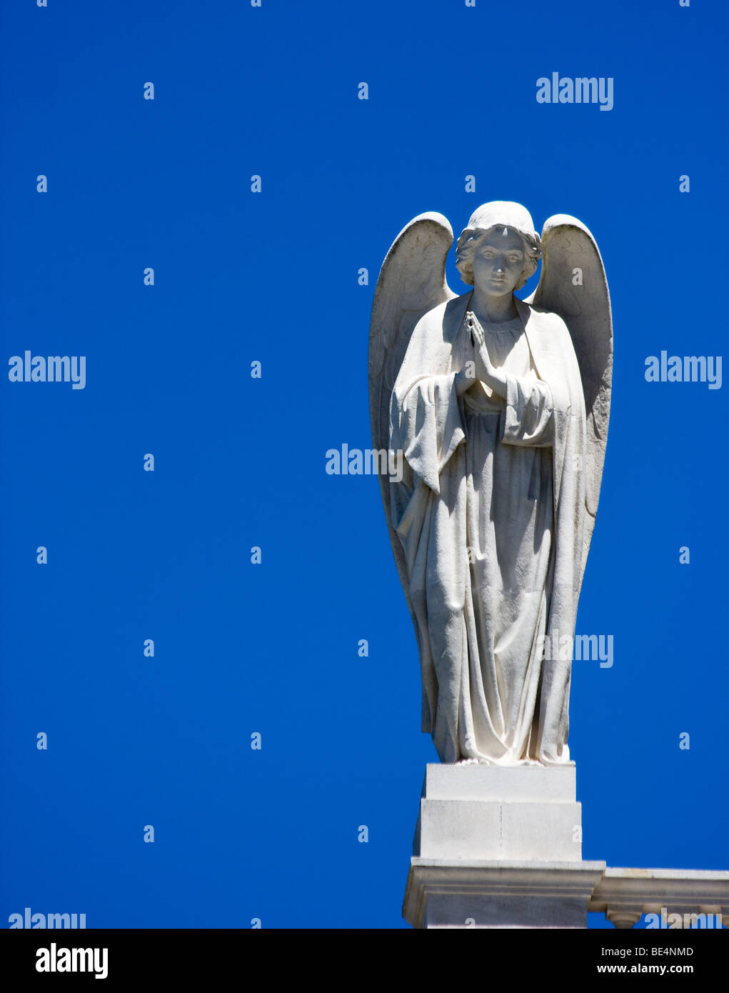 A white statue of an angel praying at Our Lady of Fatima Basilica in Fatima, Portugal. Stock Photo