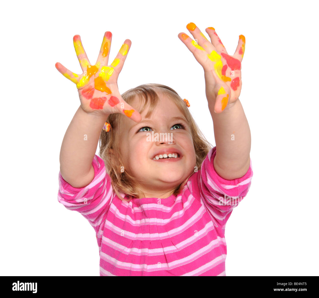 Young girl with paint on hands isolated over white background Stock Photo