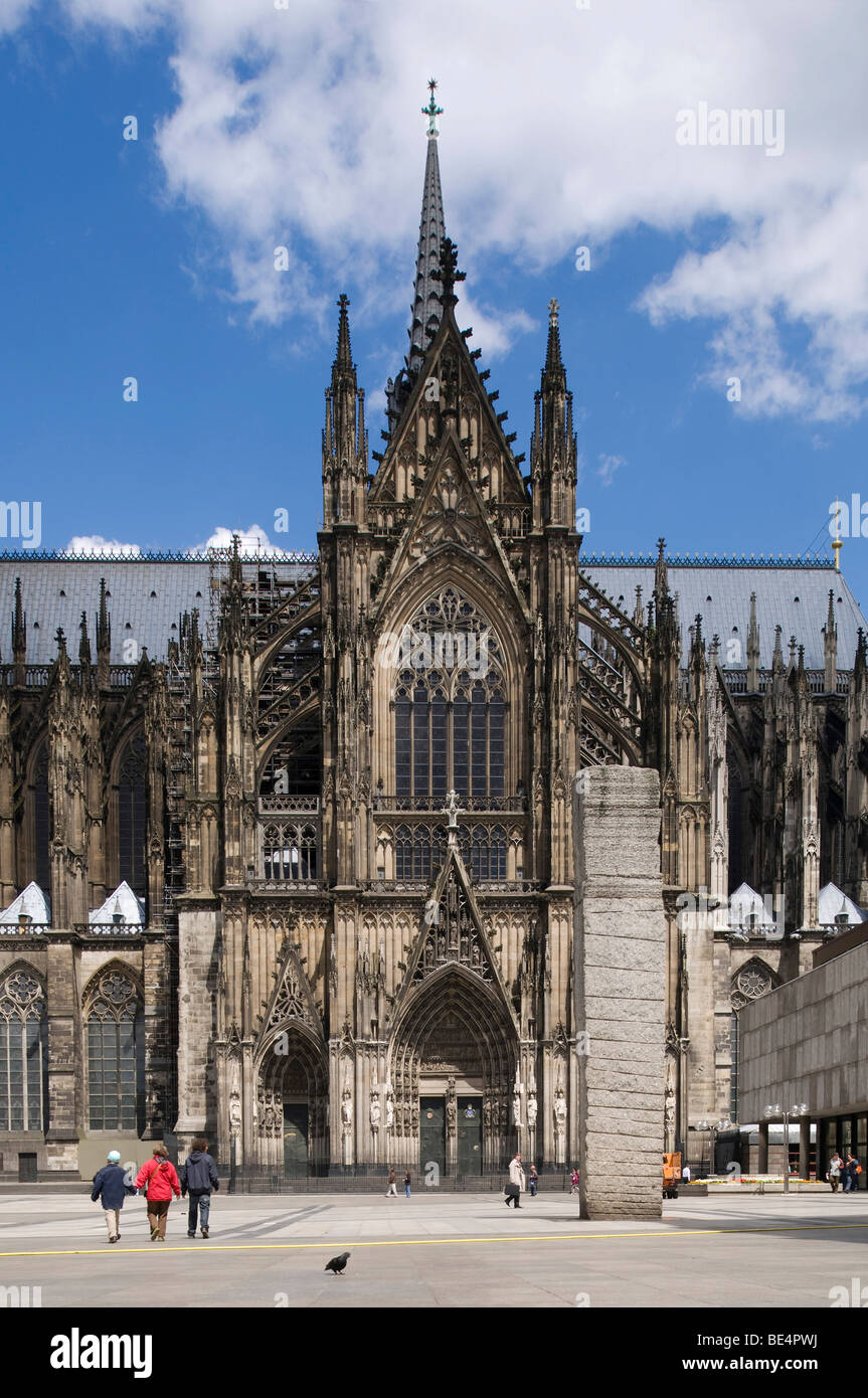 Cologne Cathedral, High Cathedral of St. Peter and Maria, portal of the southern transept, tourists walking in front, Cologne, Stock Photo