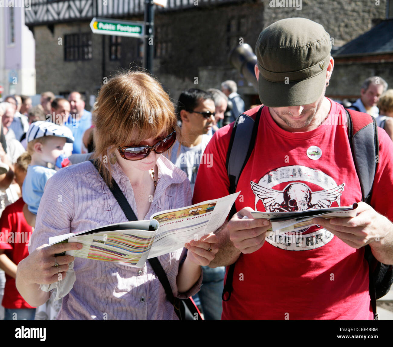 Festival Goers Reading Brochure at Ludlow Food Festival 2009 Stock Photo