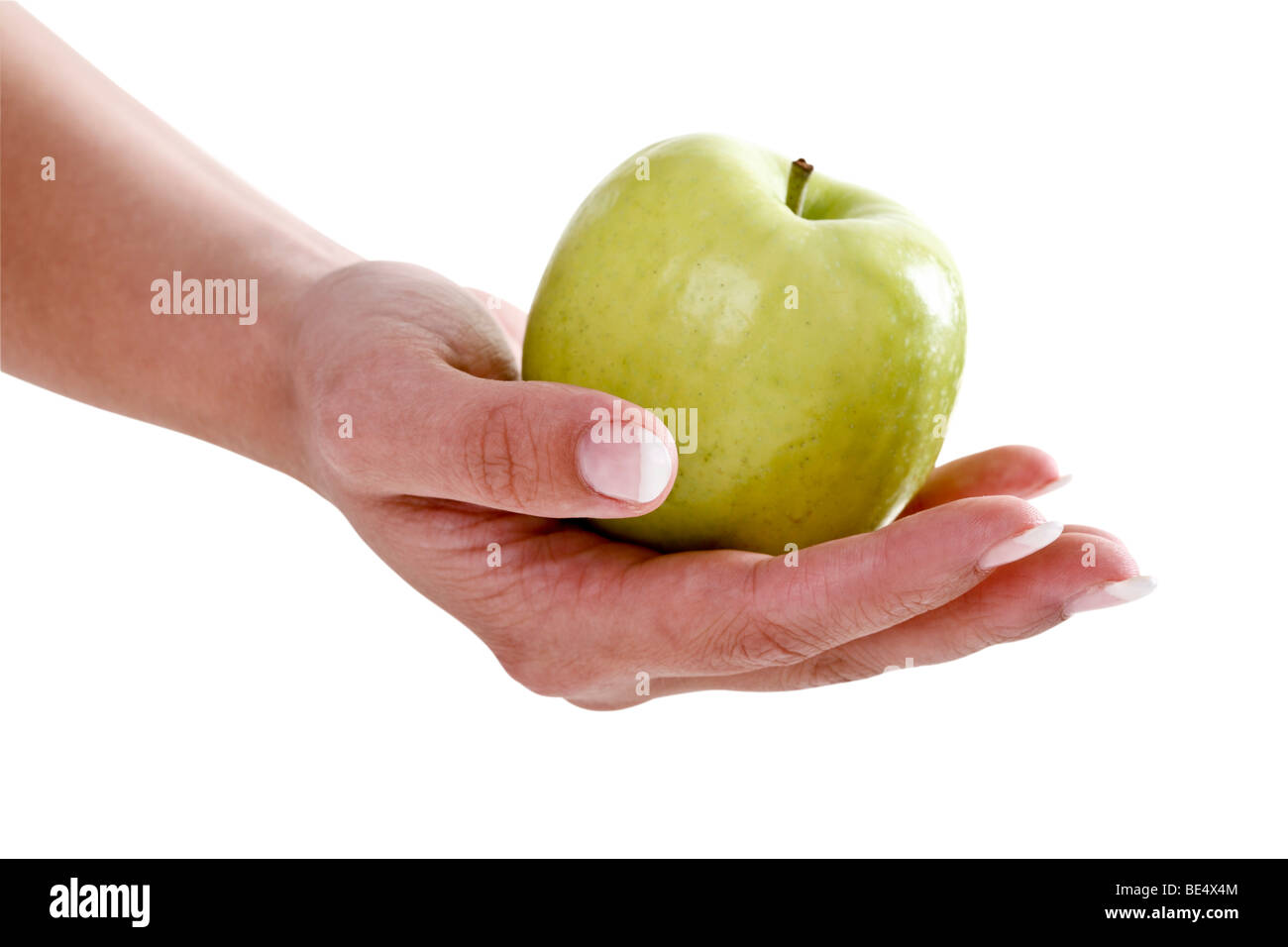 Hand holding a green apple Stock Photo