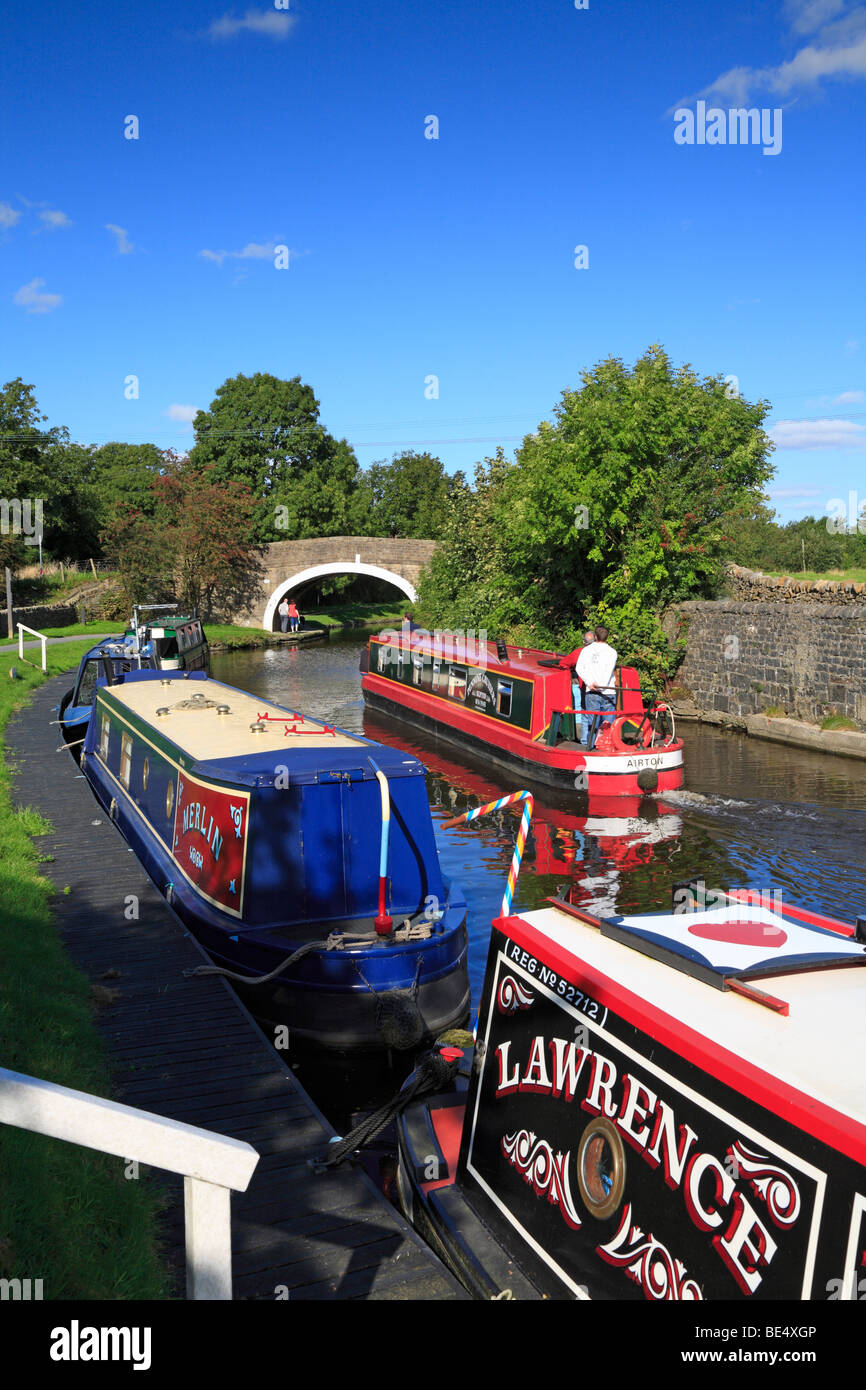 Narrow boats on the Leeds and Liverpool Canal at Greenberfield, Barnoldswick, Lancashire, England, UK. Stock Photo