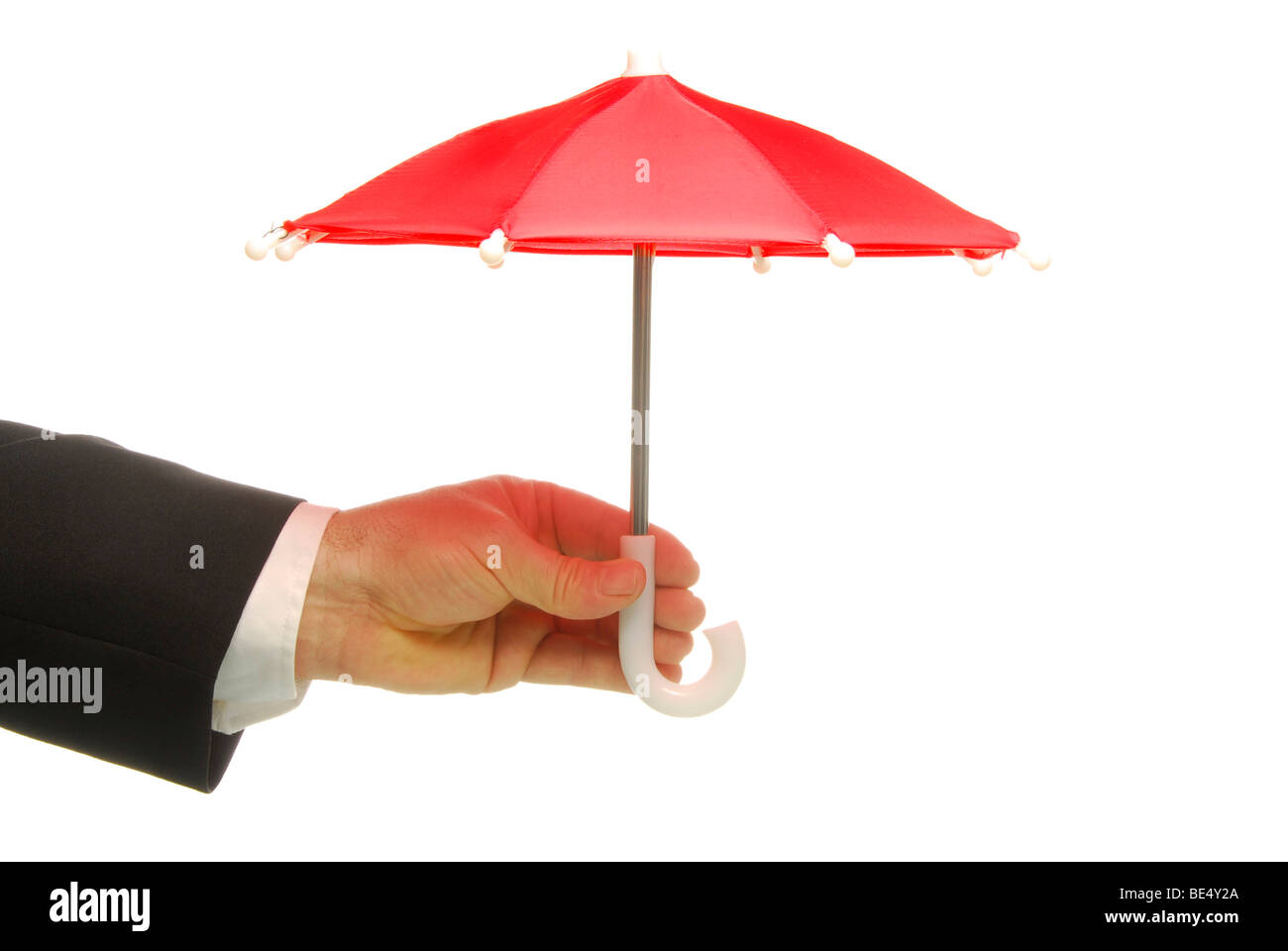 Business man holding a red umbrella, symbolic image for giving