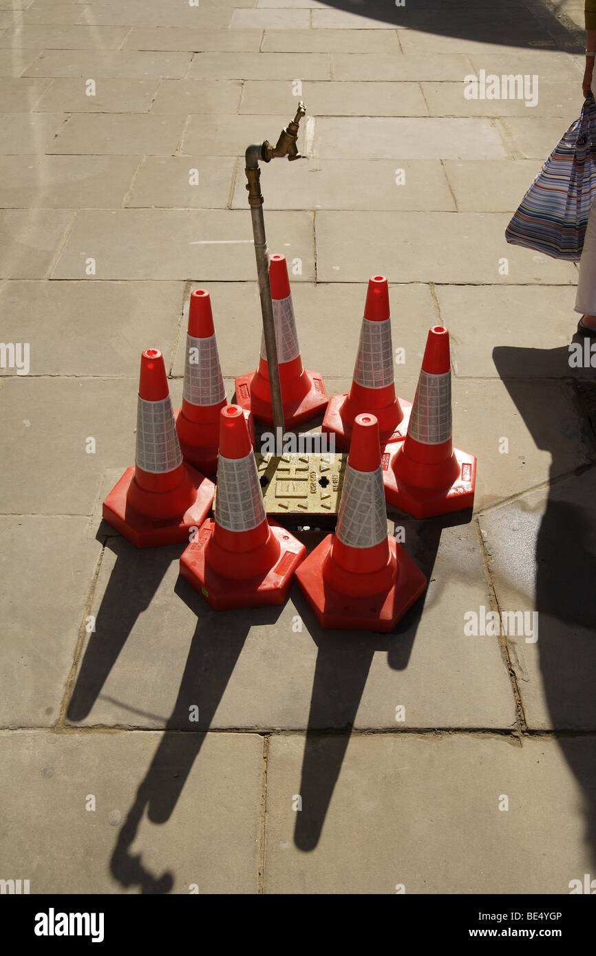 Stand pipe coned off in the street.water shortage,drought burst water main.london Stock Photo