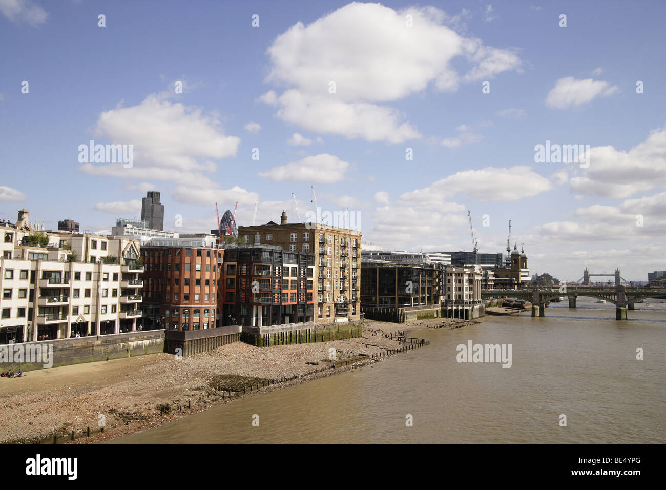 River thames people enjoying low tide sand bankside in the summer.Tourism londoners city life recreation southbank preservation Stock Photo