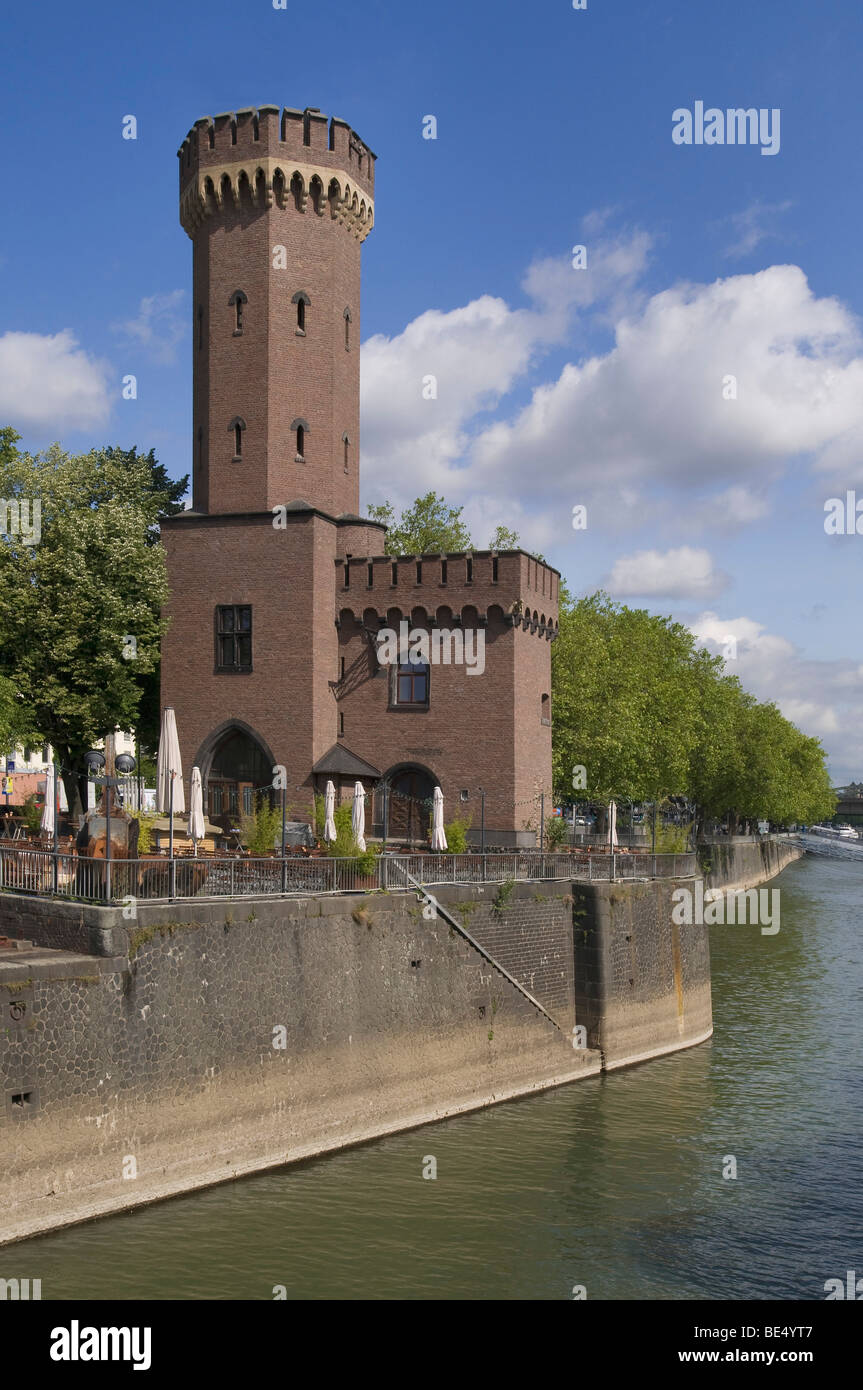 Malakoff Tower, housing the electro-hydraulic slewing gear for the swing bridge at Rheinauhafen in front of the Chocolate Museu Stock Photo