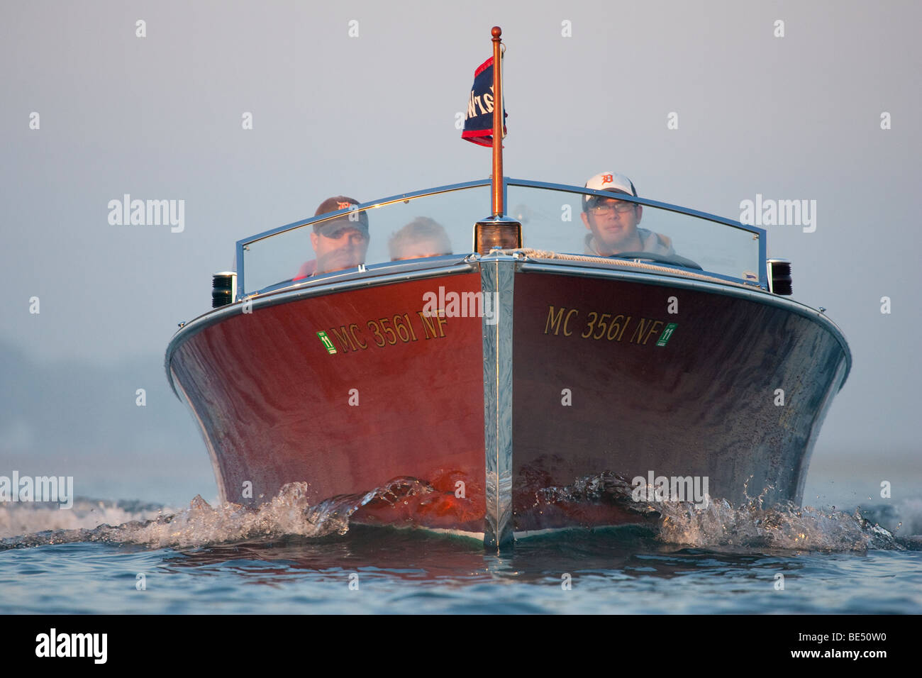 An antique, wooden boat approaching at moderate speed Stock Photo Alamy