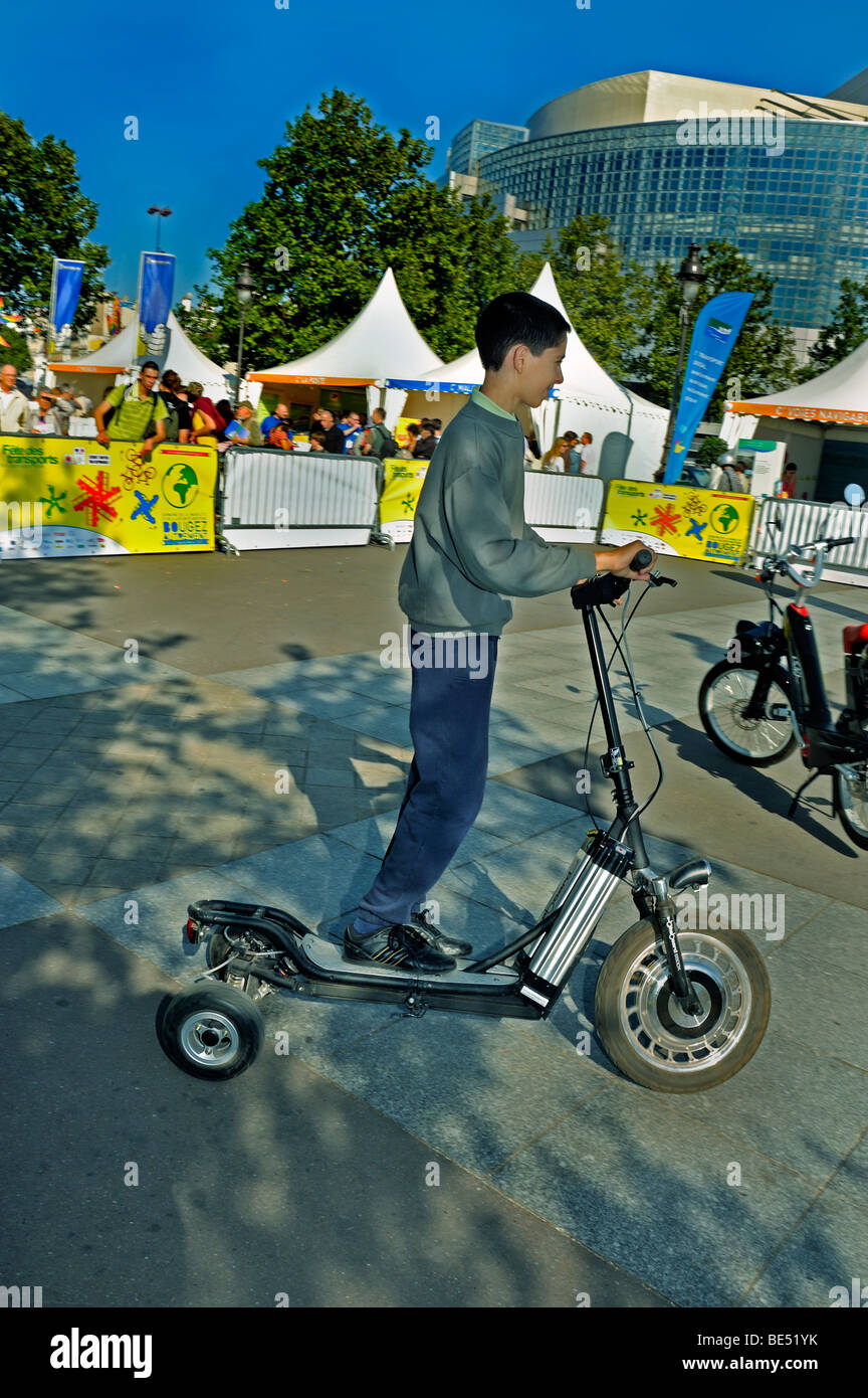 Paris, France, 'Alternative Transportation' Show, Young Teenager Riding Electric scooter, People using new exciting technology. Stock Photo