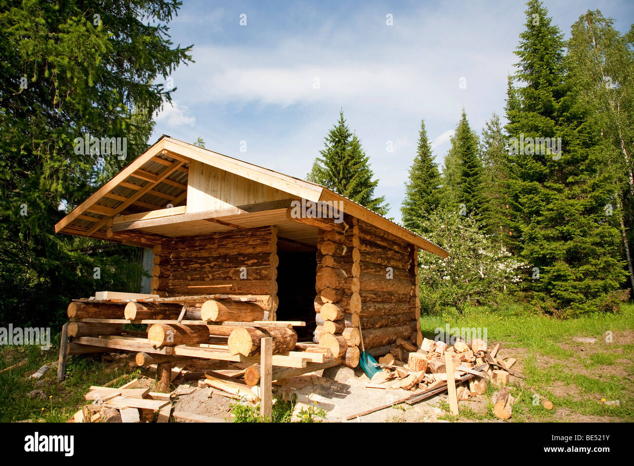 Log cabin made of barked spruce logs under construction , Finland Stock