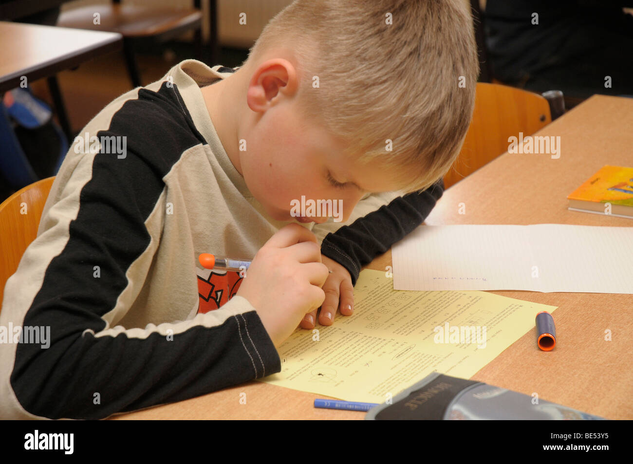 Schoolboy, 10 years old, during an exam Stock Photo