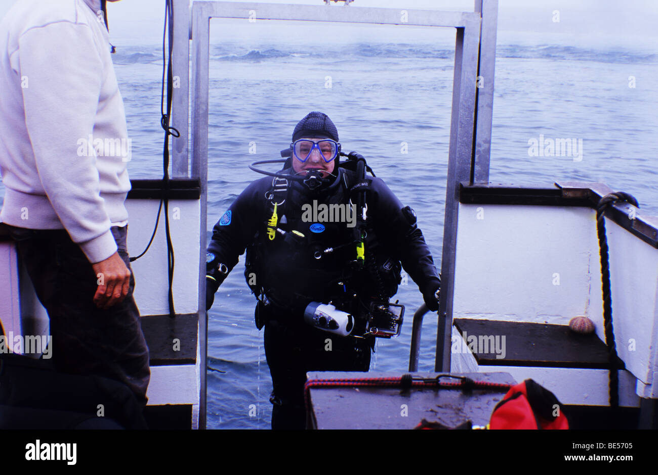 Scuba diving the Farne Islands. Northumberland UK. Diver comes aboard