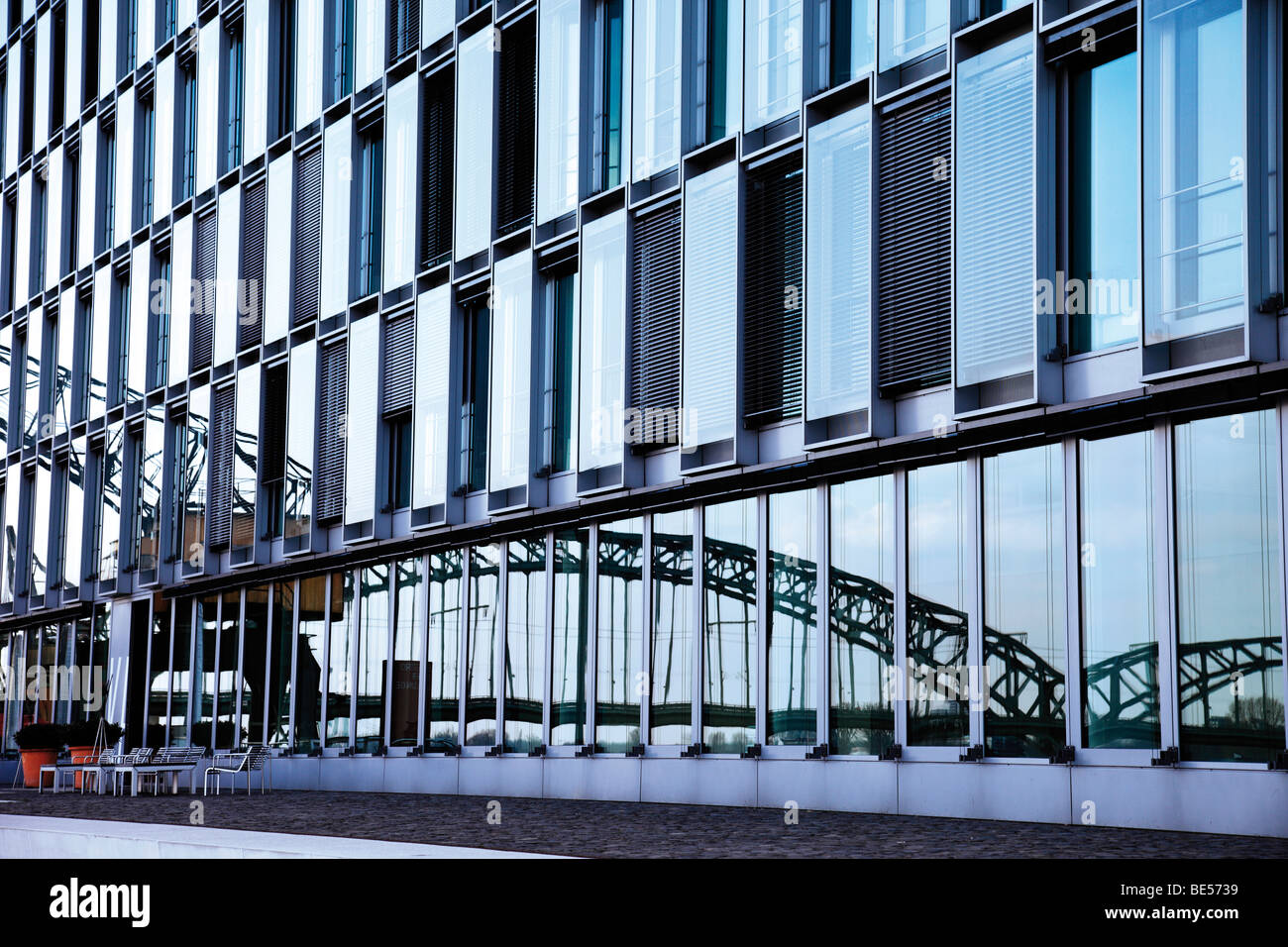 Reflection of Suedbruecke Bridge in a glass facade, Cologne, North Rhine-Westphalia, Germany, Europe Stock Photo
