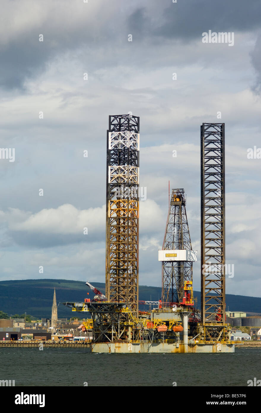A jackup oil drilling rig, the Ensco 80, in the Cromarty Firth, by the town of Invergordon. Stock Photo