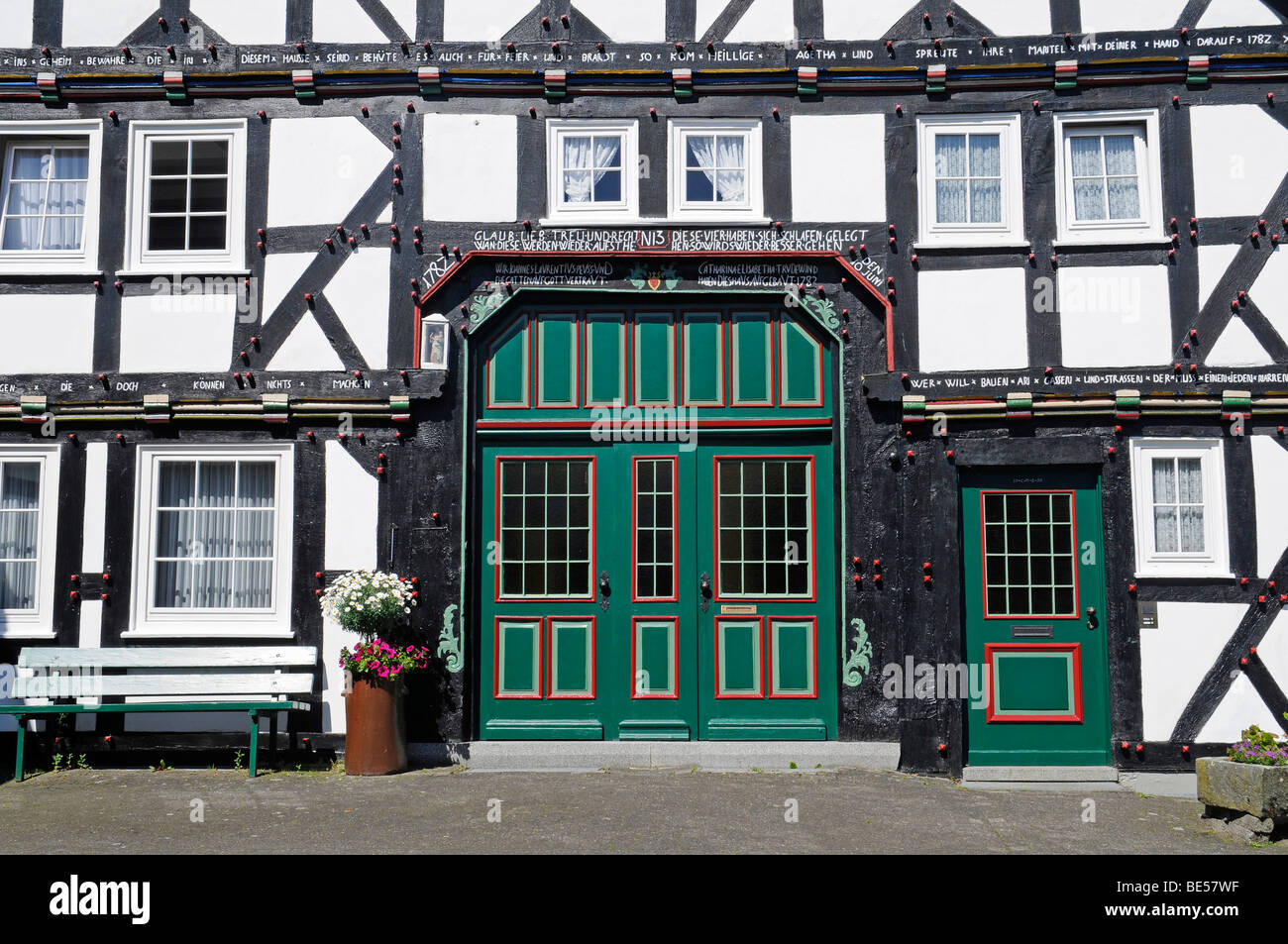 Ornate wooden door, entrance, half-timbered, house, Eversberg, Dorf, Meschede, Sauerland region, North Rhine-Westphalia, German Stock Photo