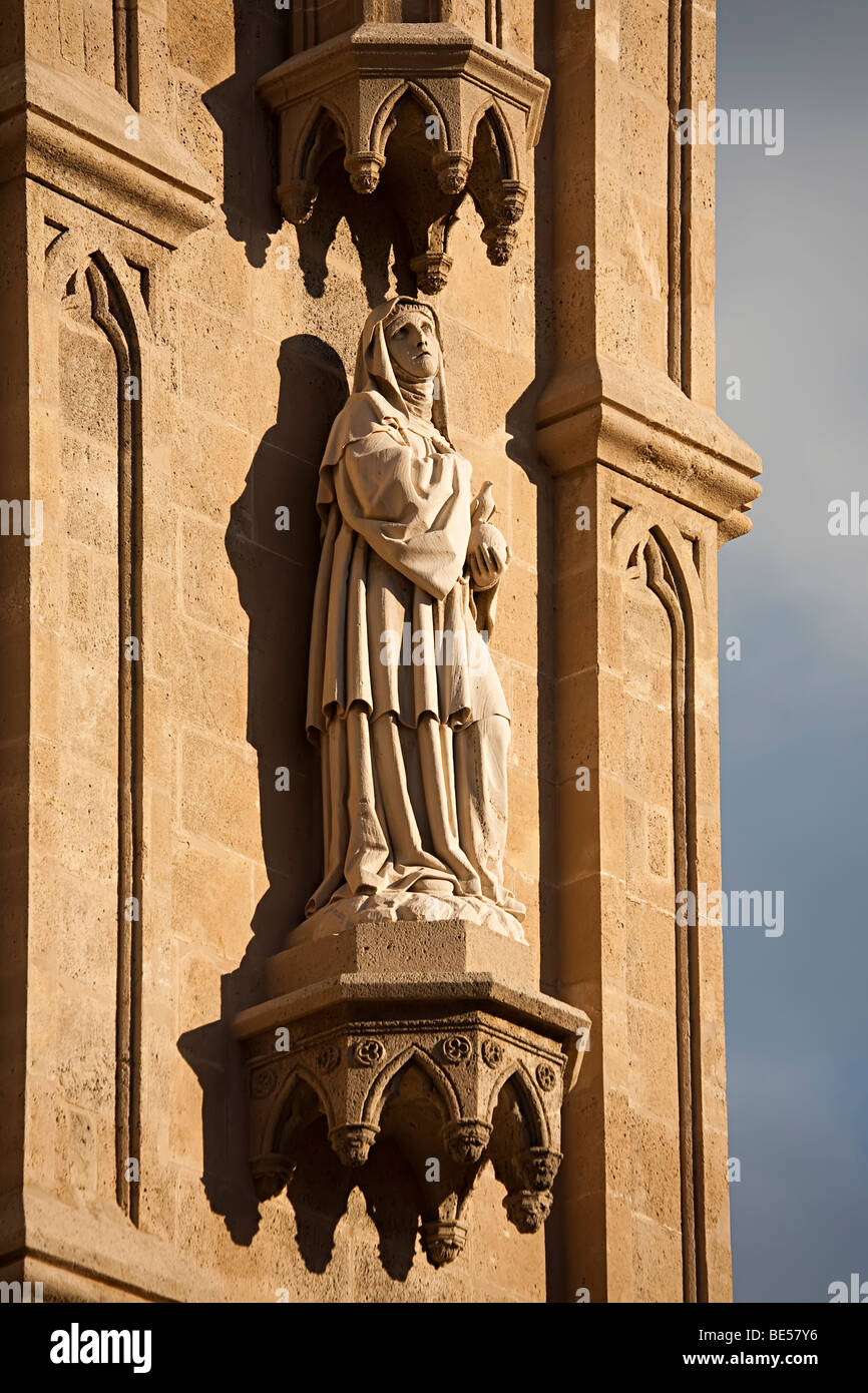 Statue of woman holding globe with bird on wall of Cathedral Palma Mallorca Spain Stock Photo