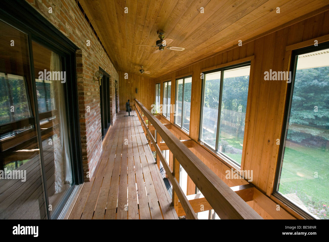 Interior view of the atrium (solarium) in a passive solar 'envelope house' design home in residential neighborhood. Stock Photo