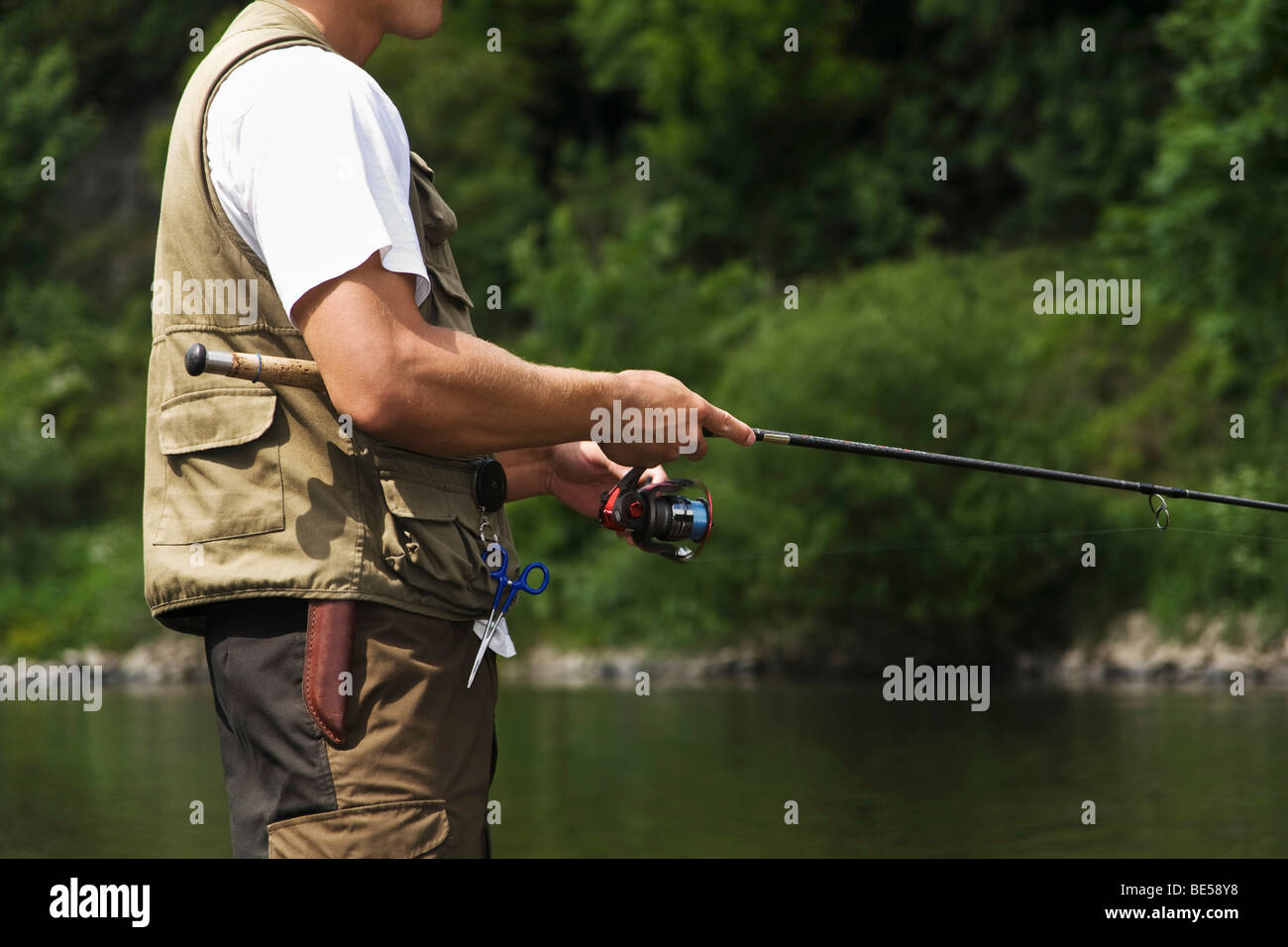 Angler with rod Stock Photo