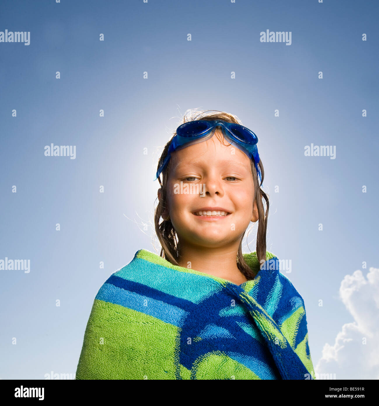 Young girl wrapped in beach towel Stock Photo Alamy