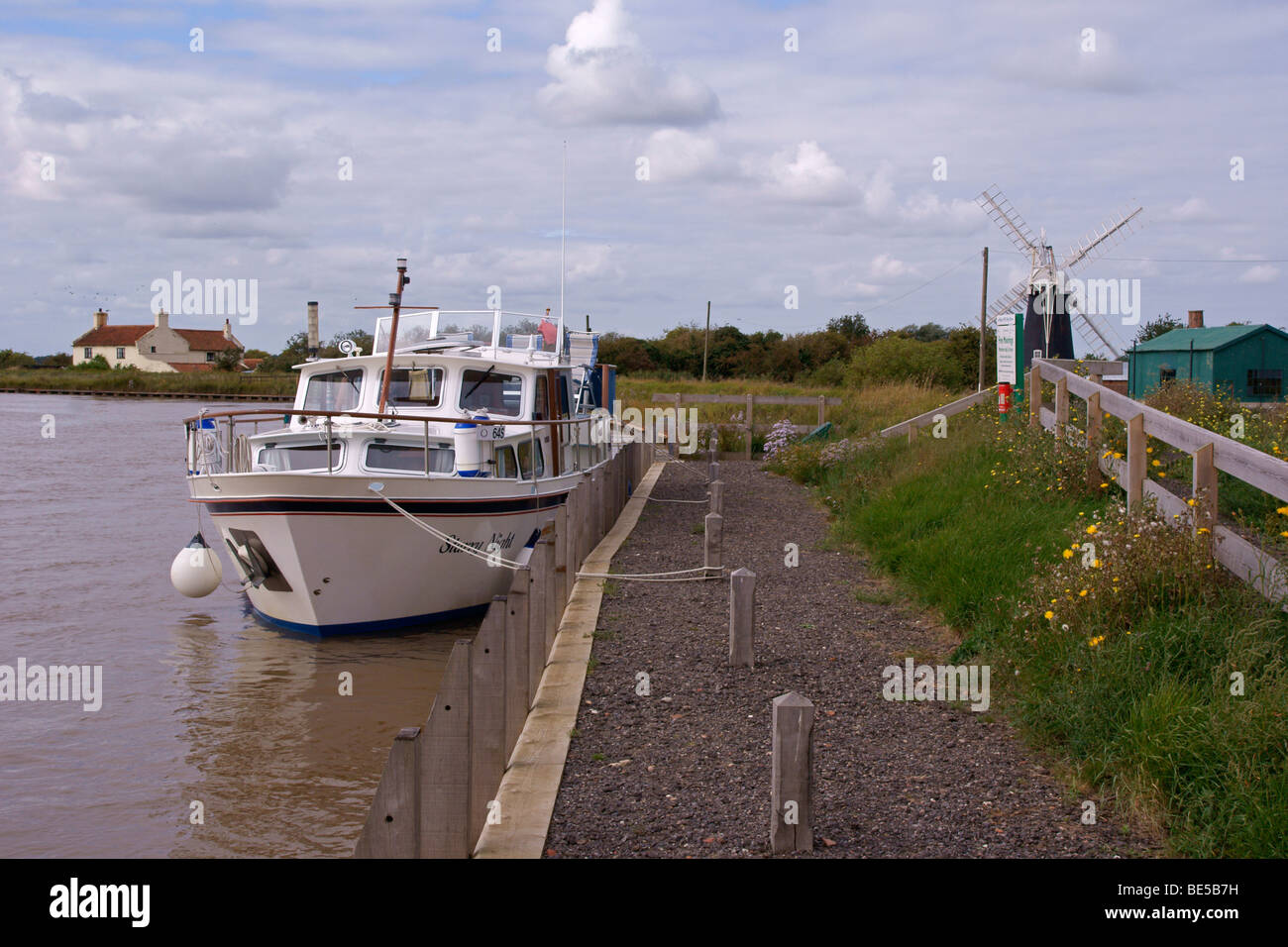 Motorboat moored at Polkey's Mill staithe on the Norfolk Broads Stock Photo