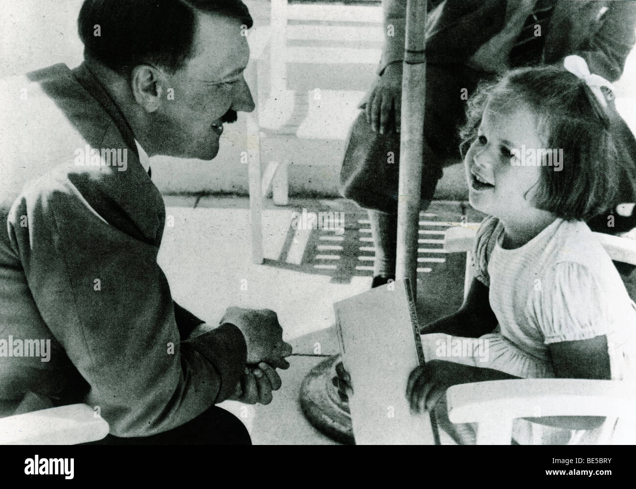 Adolf Hitler talking with a girl, historical photo circa 1937 Stock Photo