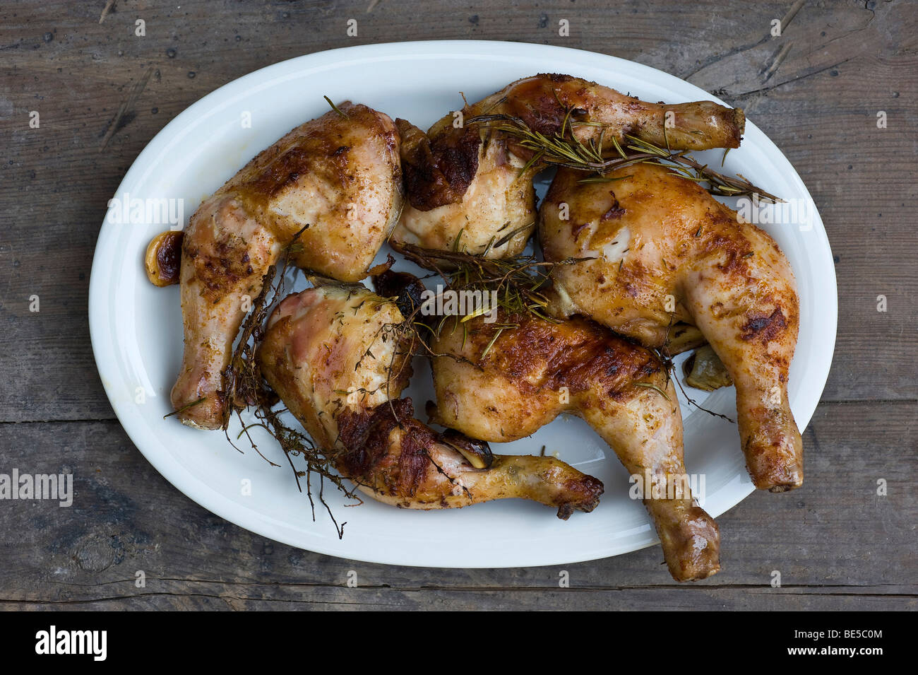 Grilled chicken legs with rosemary, thyme and garlic Stock Photo