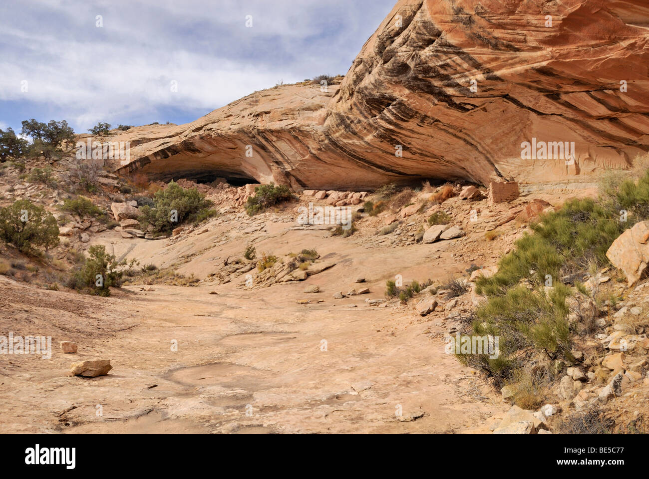 Overhanging rock face of the Cold Springs Cave, including the remains of historical dwellings of the Anasazi Indians, Bluff, Ut Stock Photo