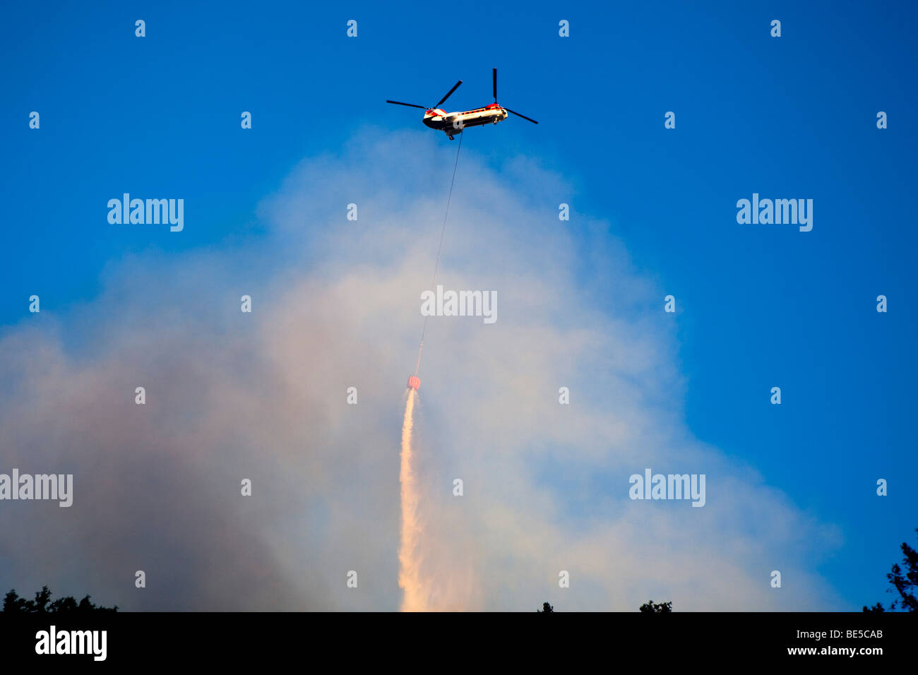 Helicopter air tanker dropping retardant at California Lockheed ...