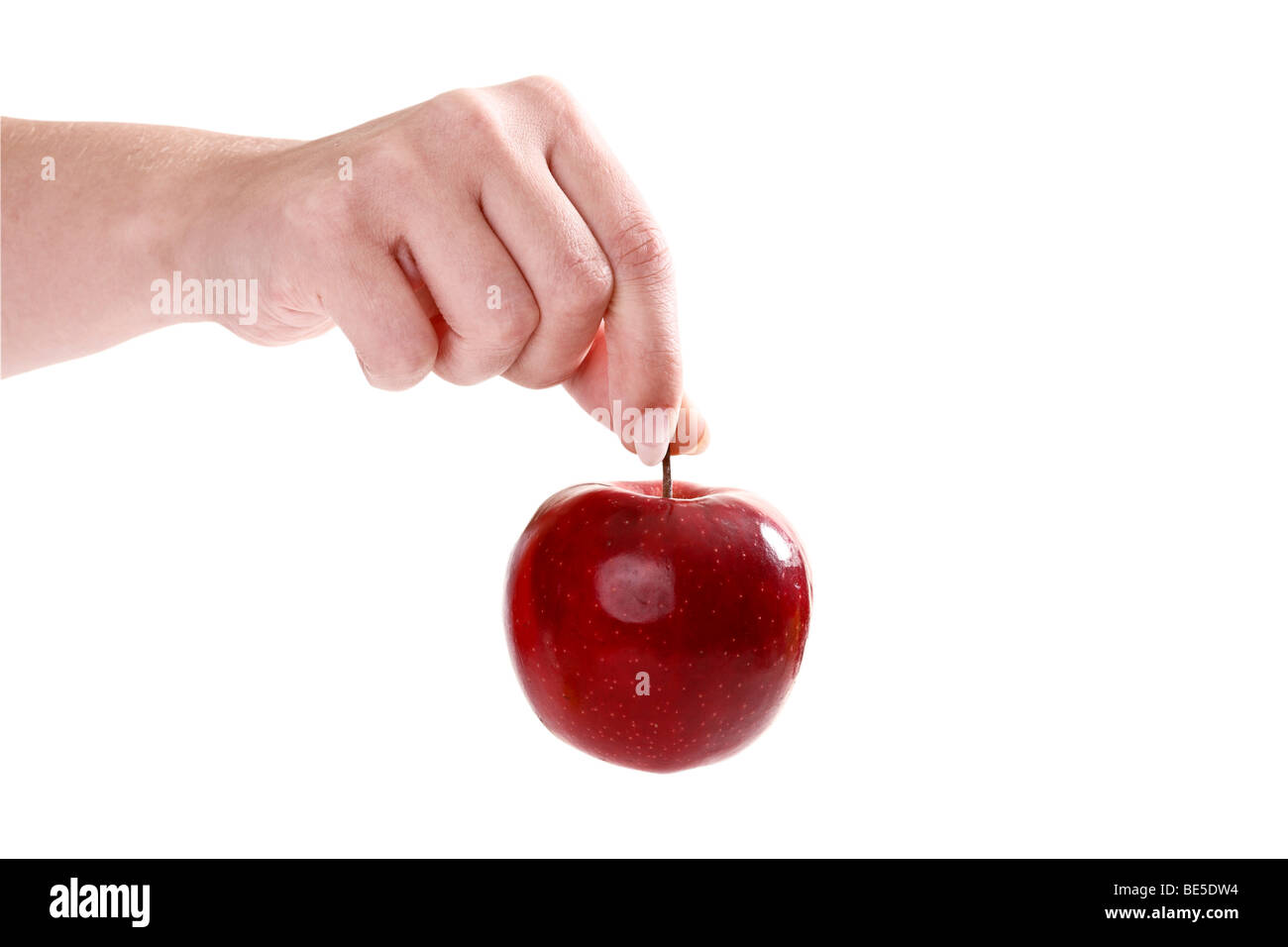 Hand holding a red apple Stock Photo