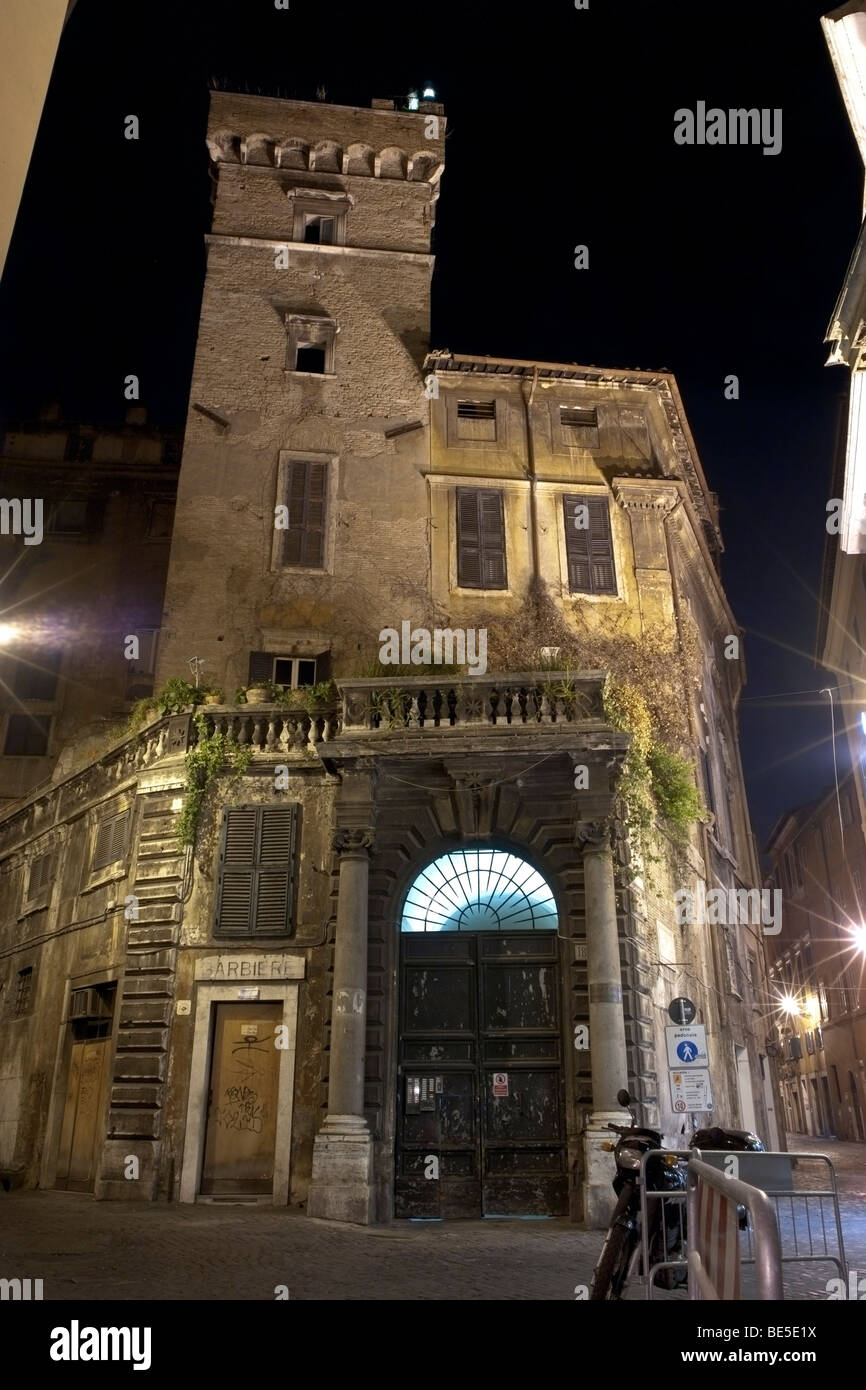 Rome, Italy. Nocturne view of Palazzo Scapucci, which incorporates the  Torre dei Frangipane, dating back to the XIV century Stock Photo - Alamy, image size:866x1390