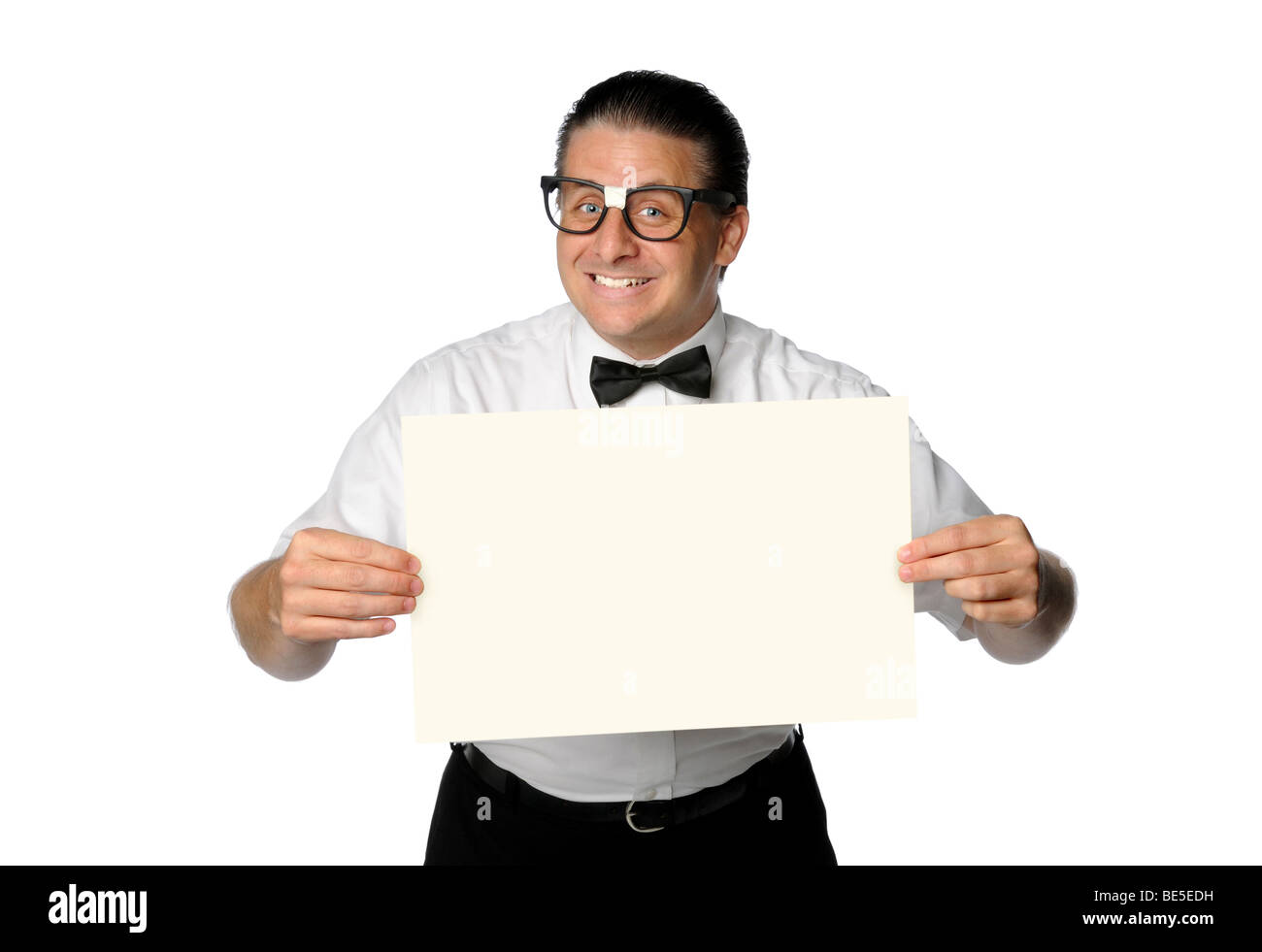 Nerd smiling and holding blank sign isolated over white Stock Photo