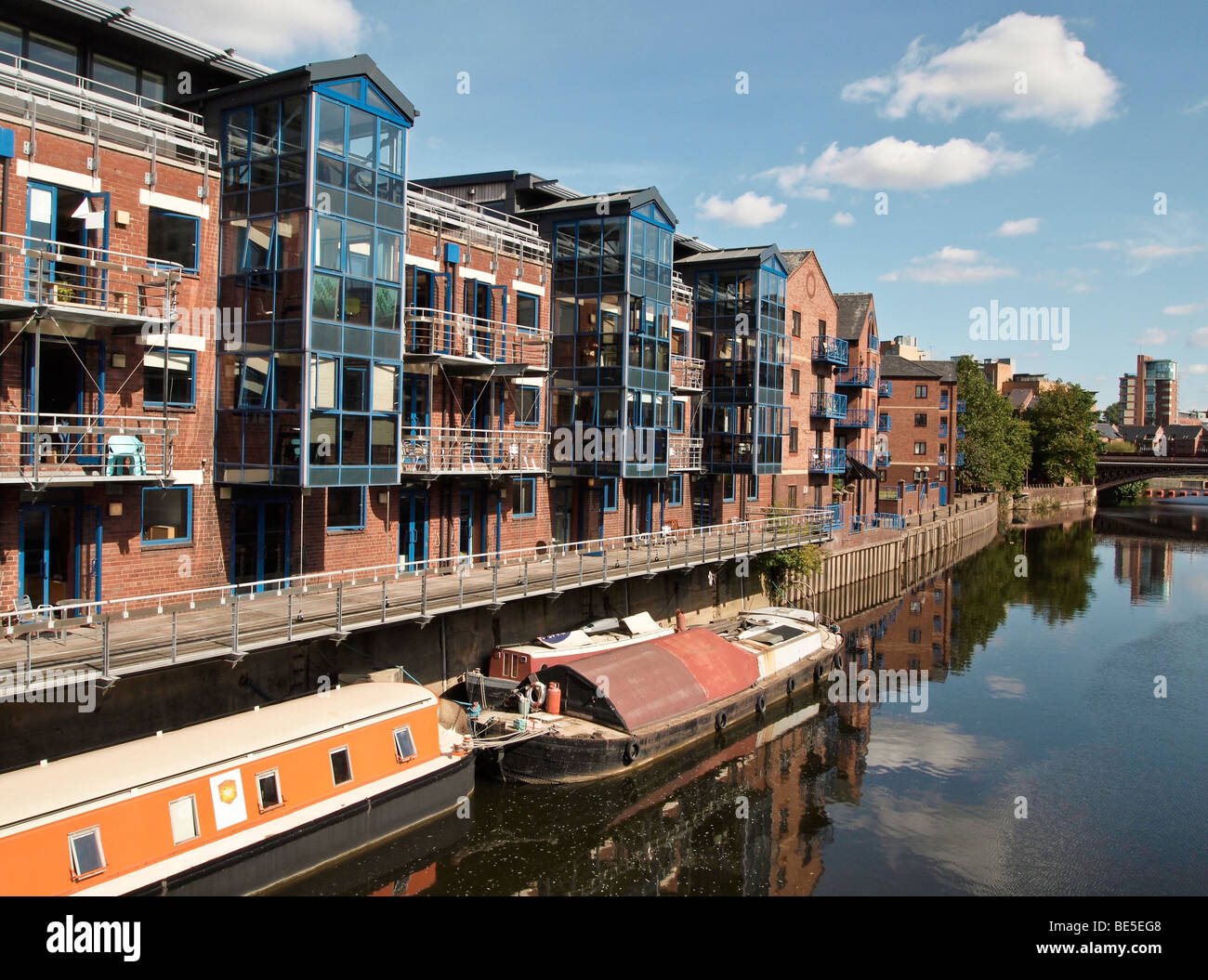 River Aire in Leeds UK with apartments and longboats Stock Photo - Alamy