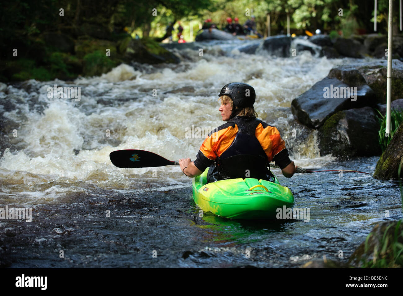 A person kayaking on the Tryweryn river, National White Water Centre