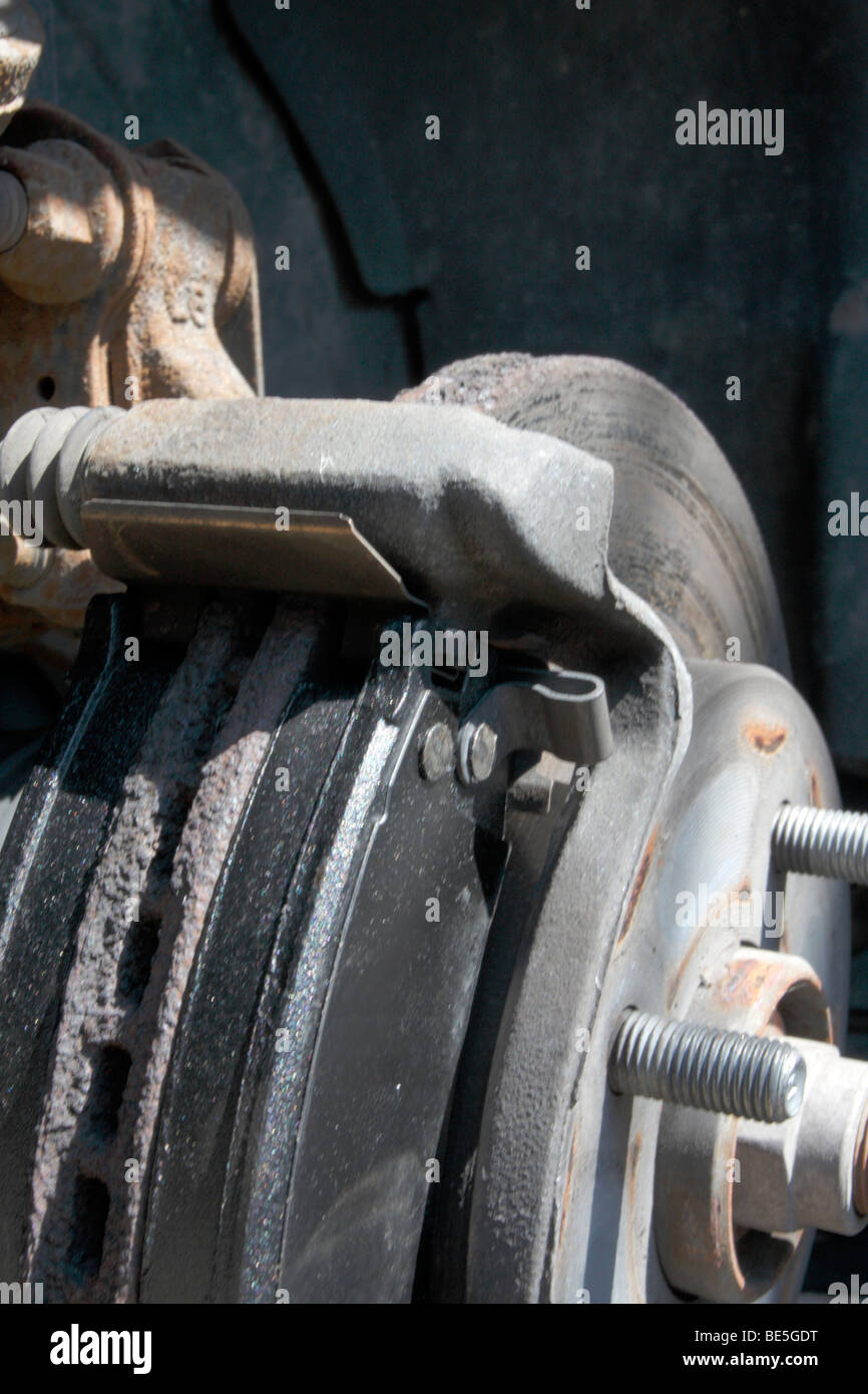 New brake pads (old rusty rotor) on a disc brake assembly on a