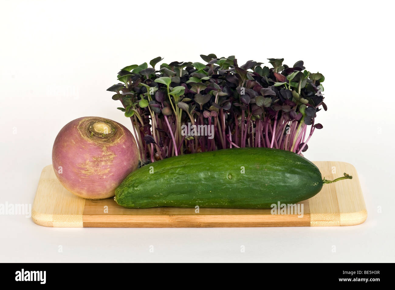 Radish sprouts, mini cucumber and round radish Stock Photo