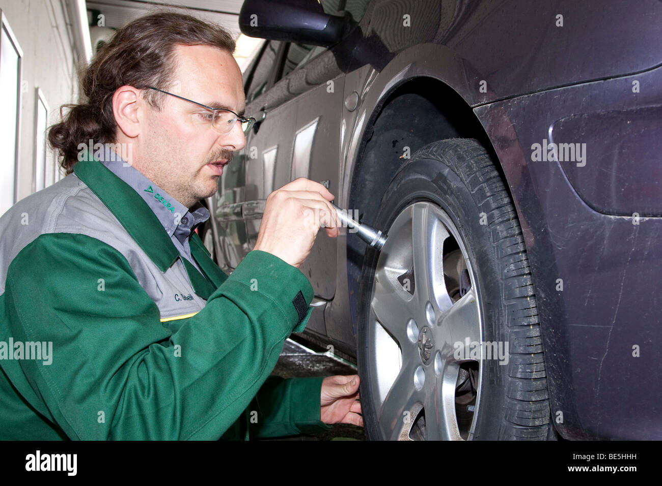 General car inspection, by the vehicle expert Christoph Scheifele at the Dekra AG in Stuttgart, Baden-Wuerttemberg, Germany, Eu Stock Photo