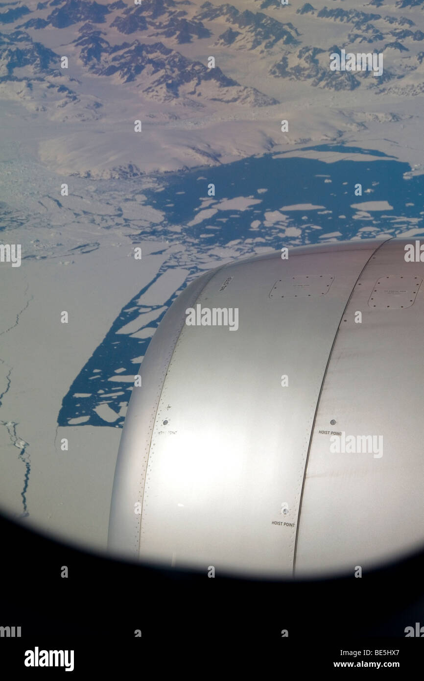 Aerial view of the glaciers and icebergs of Greenland from the window of an Airbus 330 passenger jet airliner. Stock Photo