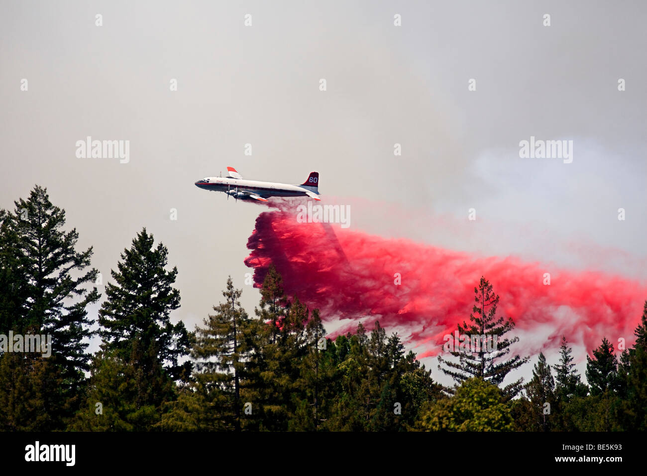 Air tanker retardant drop at California  Lockheed wildfire in Santa Cruz Mountains. CALFIRE/CDF Stock Photo