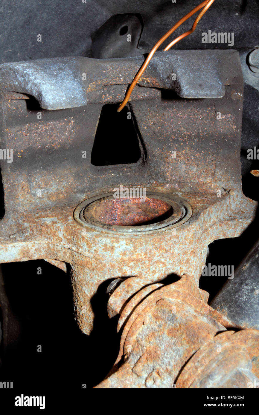 Rusted disc brake caliper suspended by wire Stock Photo Alamy