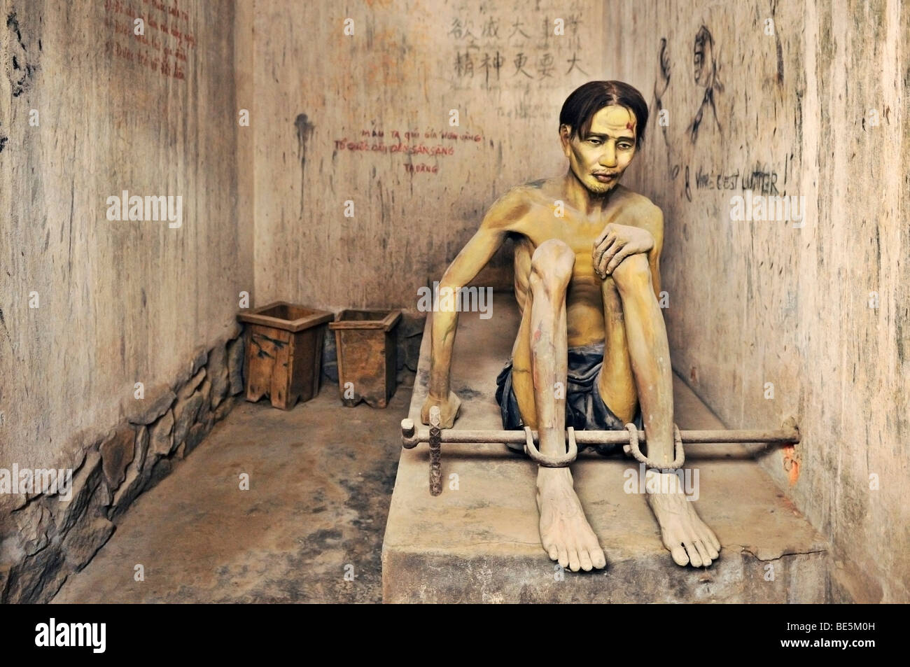 Prisoner, sculpture, in the 'tiger cage' prison cell, war museum, Ho Chi Minh City, Saigon, Vietnam, Asia Stock Photo