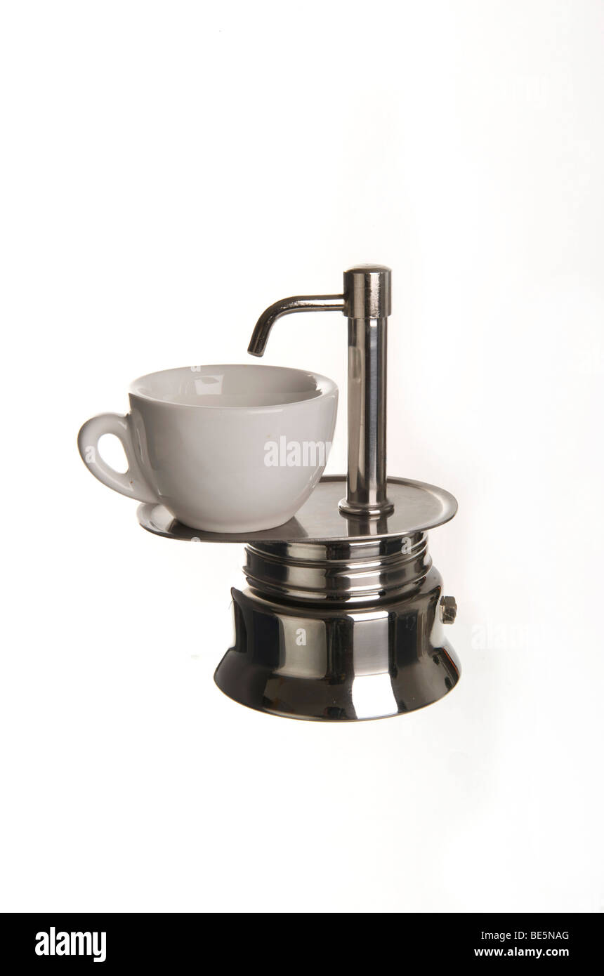 Espresso maker for the stove, with an outlet and espresso cup, stainless steel Stock Photo