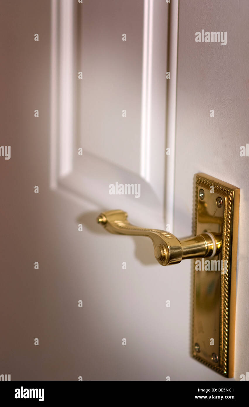 Brass Door Handle And White Panel Internal Door Stock Photo Alamy