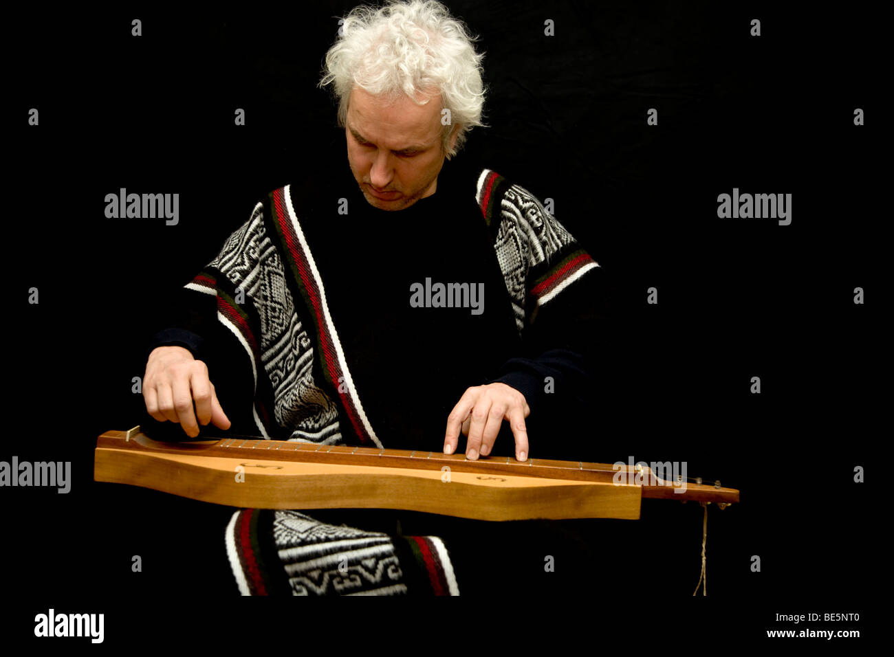 Musician in traditional costume playing the dulcimer Stock Photo Alamy