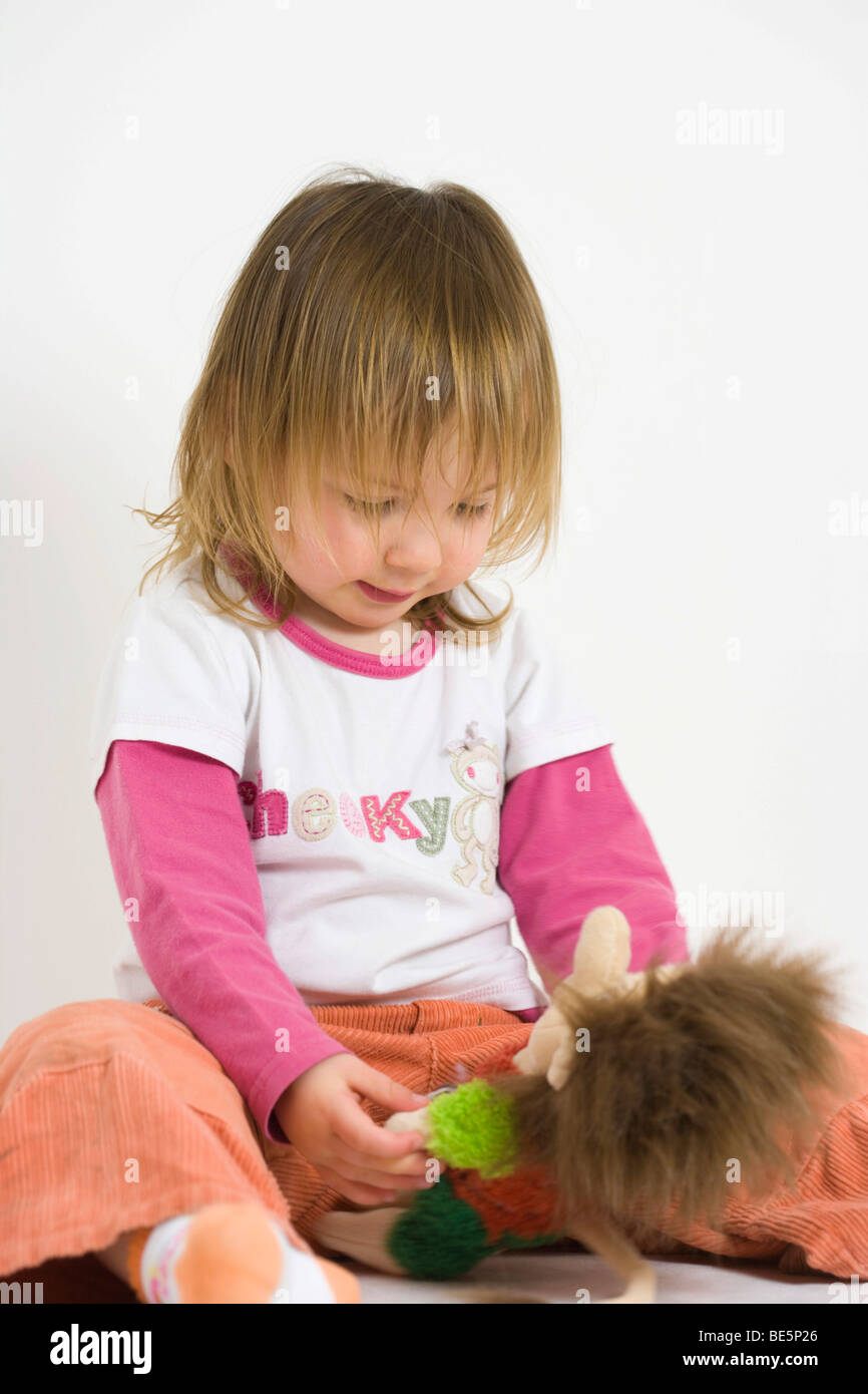 Toddler girl with toy Stock Photo