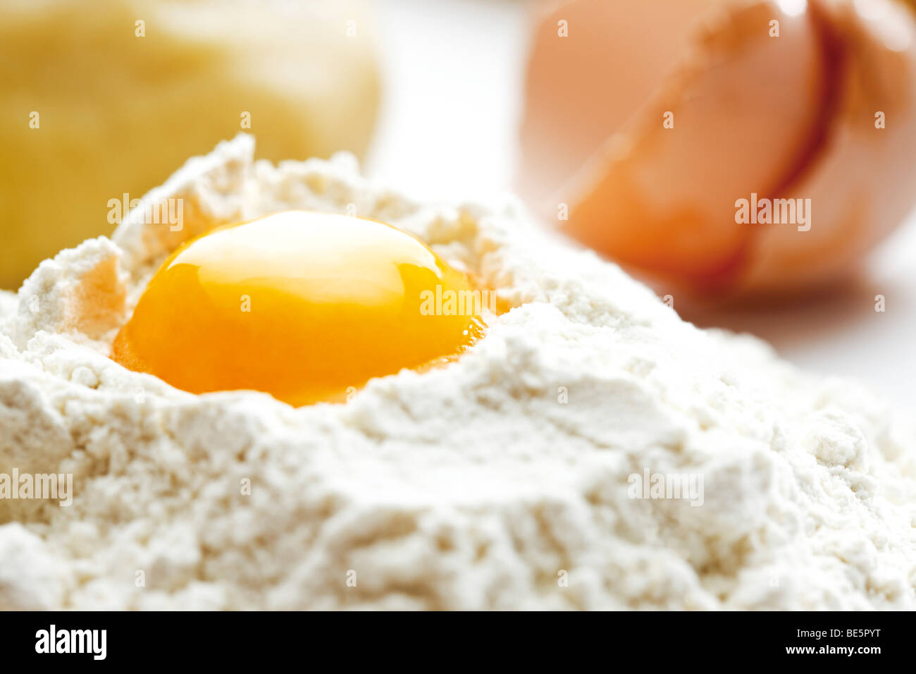 Pile of flour and an egg Stock Photo