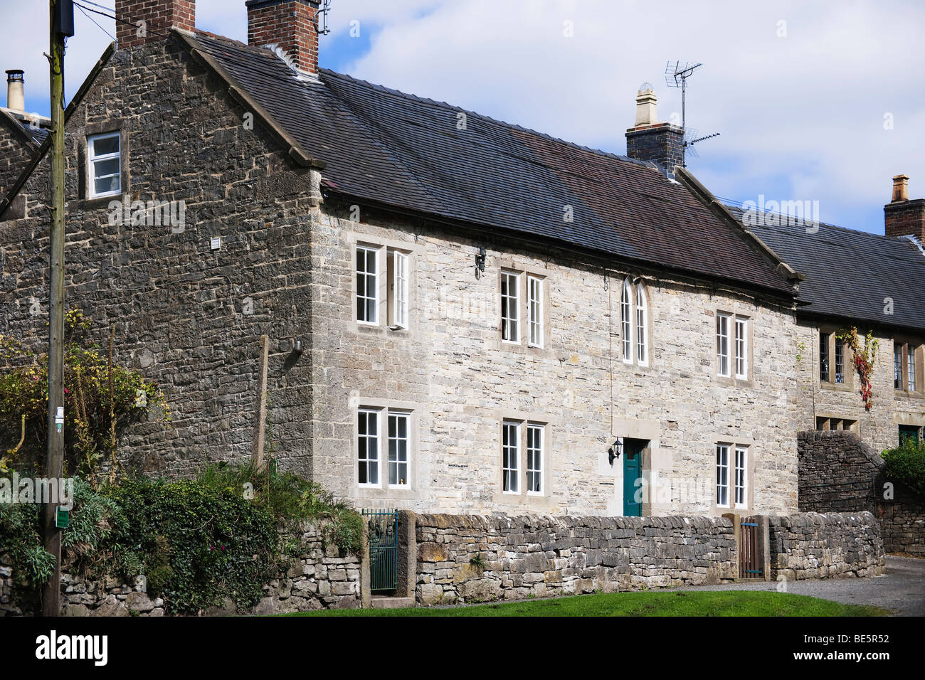 village with houses in countryside tissington, derbyshire, peak